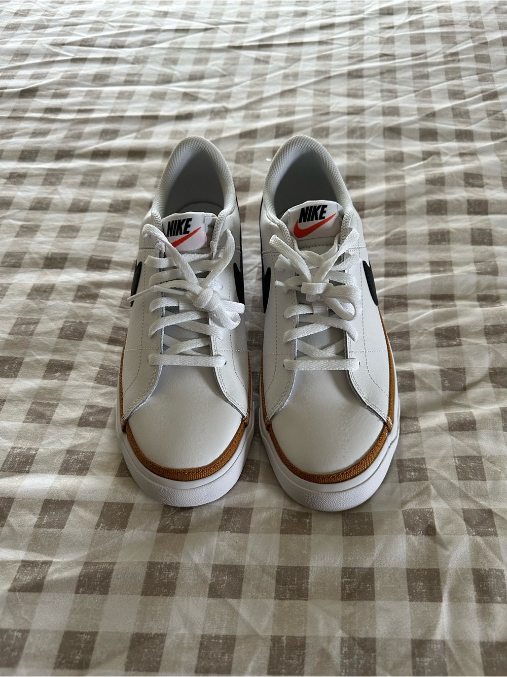 Nike White Sneakers with Black Swoosh and Brown Trim
